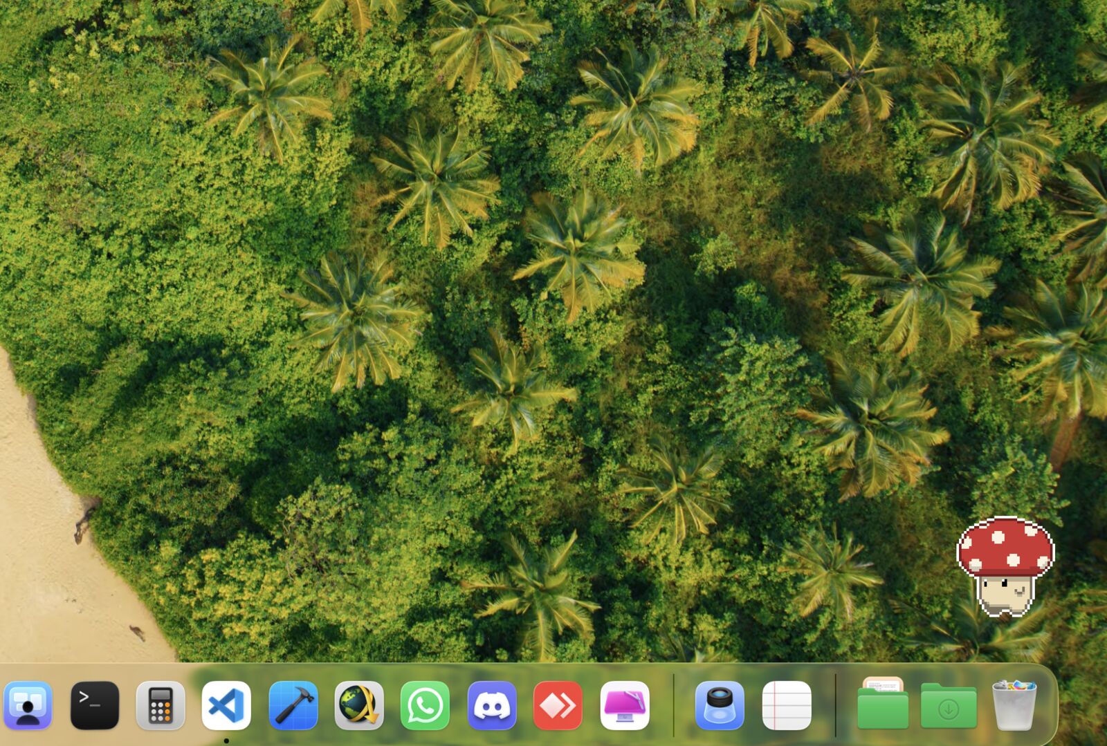 A Mac desktop with the pixel mushroom standing quietly in the bottom right corner, just above the Dock.